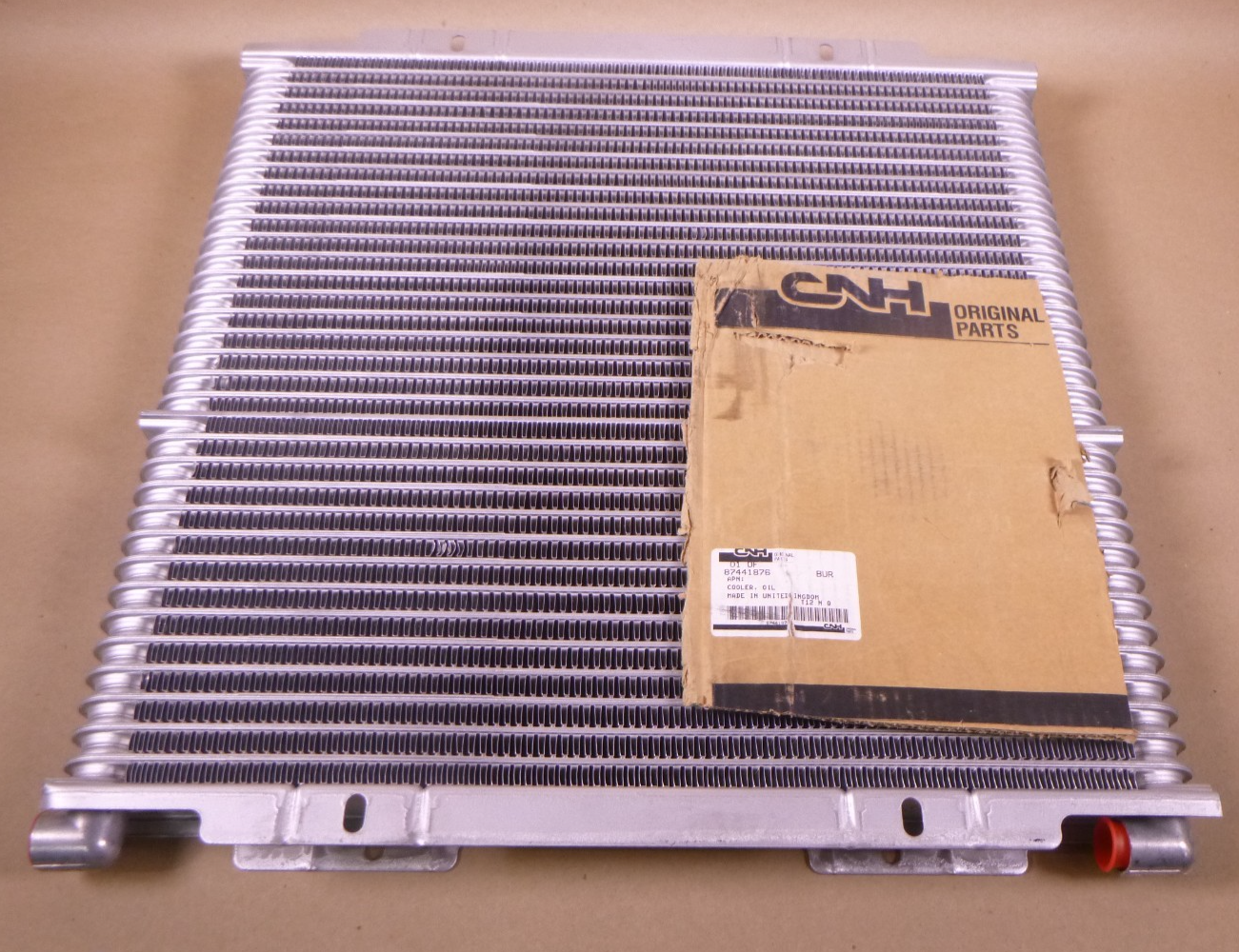 Genuine CNH Case 87441876 Oil Cooler For 580M 580N 586G 588G 590SM 570NXT OEM | Industrial Tractor Parts Supplier and Surplus Tractor Parts & Accessories