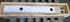 FMTV MTV M1083 Cargo Bed Life Blade Arm Tan 12414742 , 2590-01-384-0717 | Genuine FMTV Replacement Parts, LMTV Parts For Sale and Military Surplus Medium Tactical Vehicle Parts & Components
